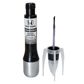 Honda touch-up pen beside a US quarter for size and portability