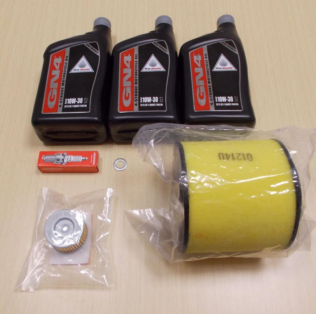 Honda TRX500 service kit packaging with parts laid out for quick identification and fitment