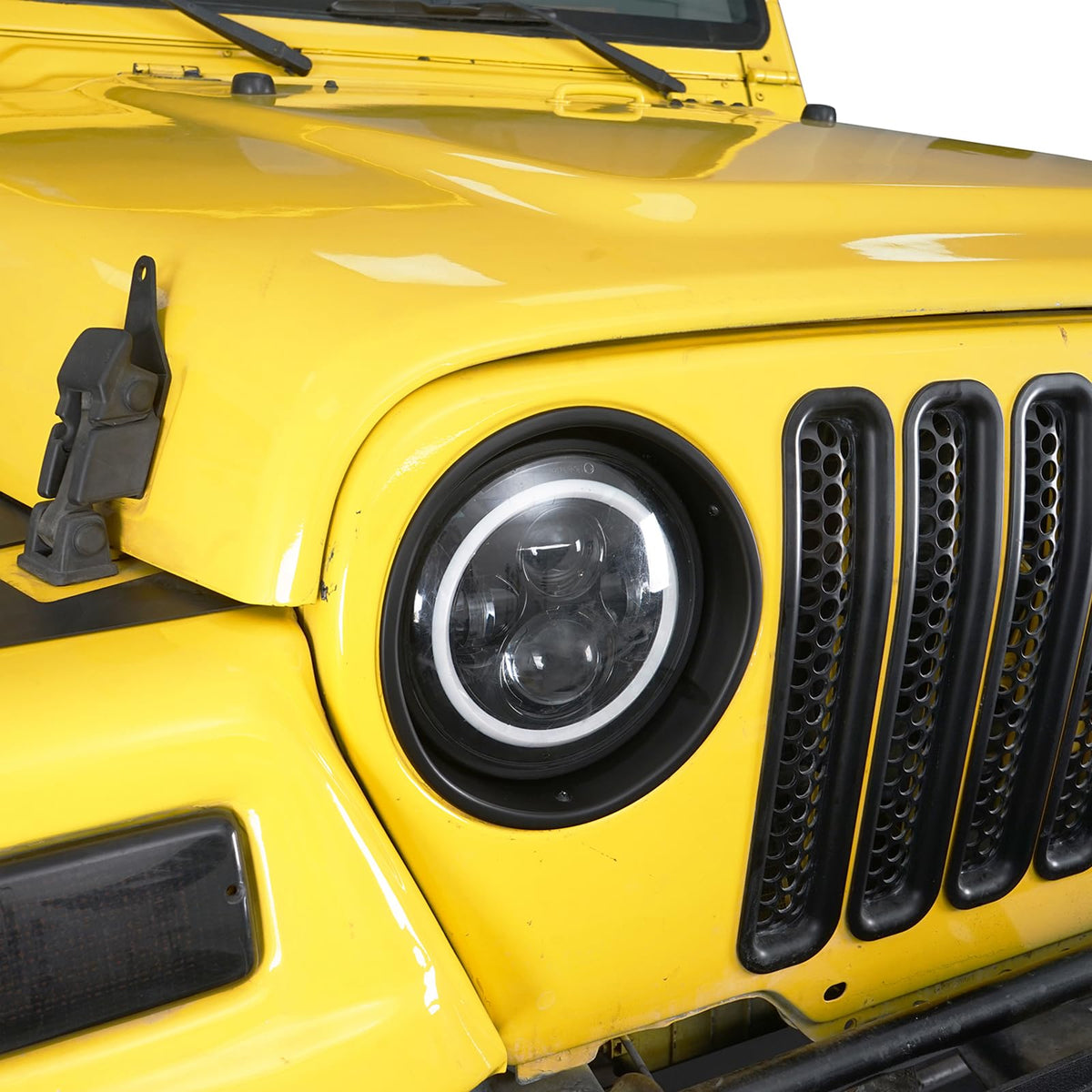 Hooke Road bezels installed on Jeep Wrangler TJ showing improved front look