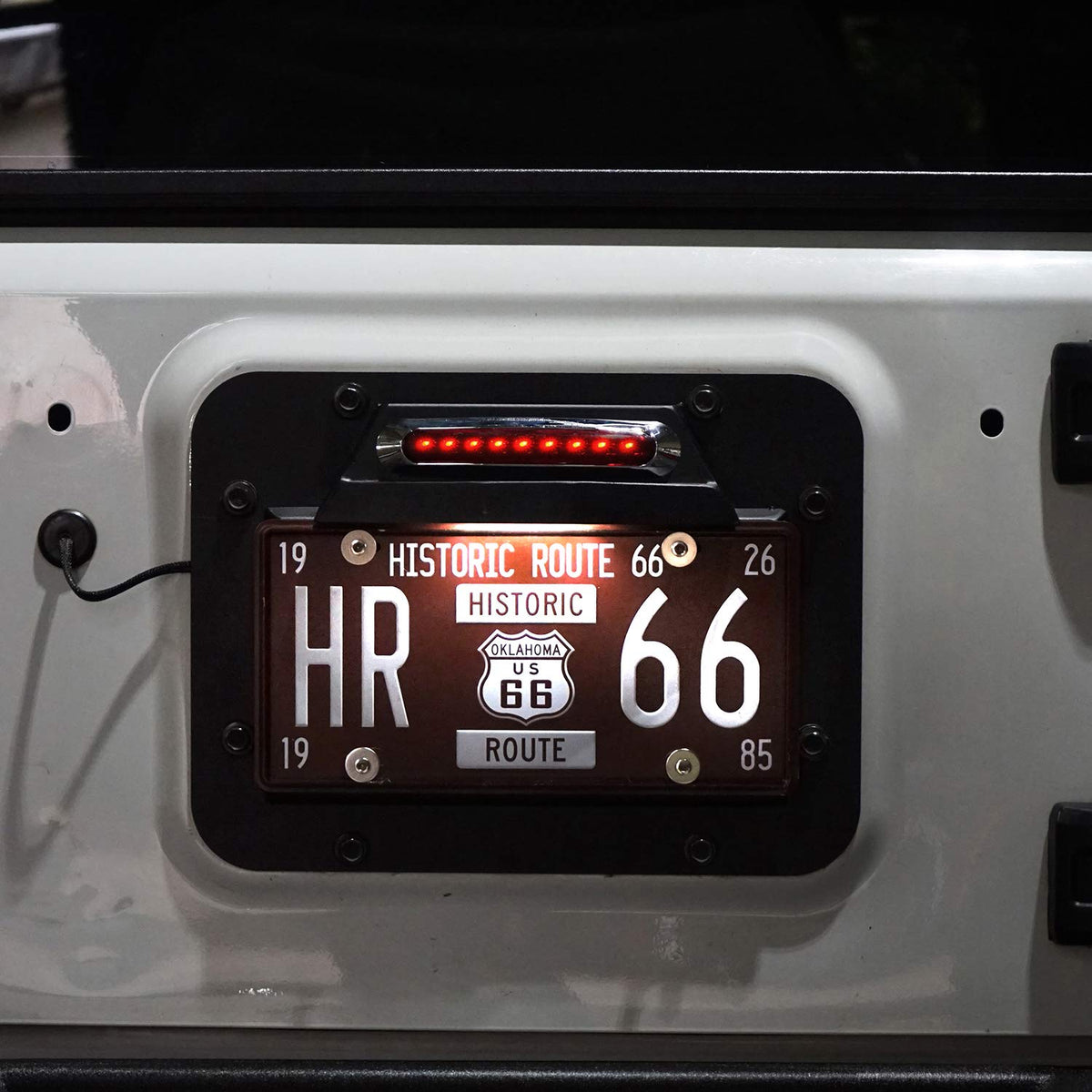 Hooke Road license plate light detail showing waterproof LED illumination benefit