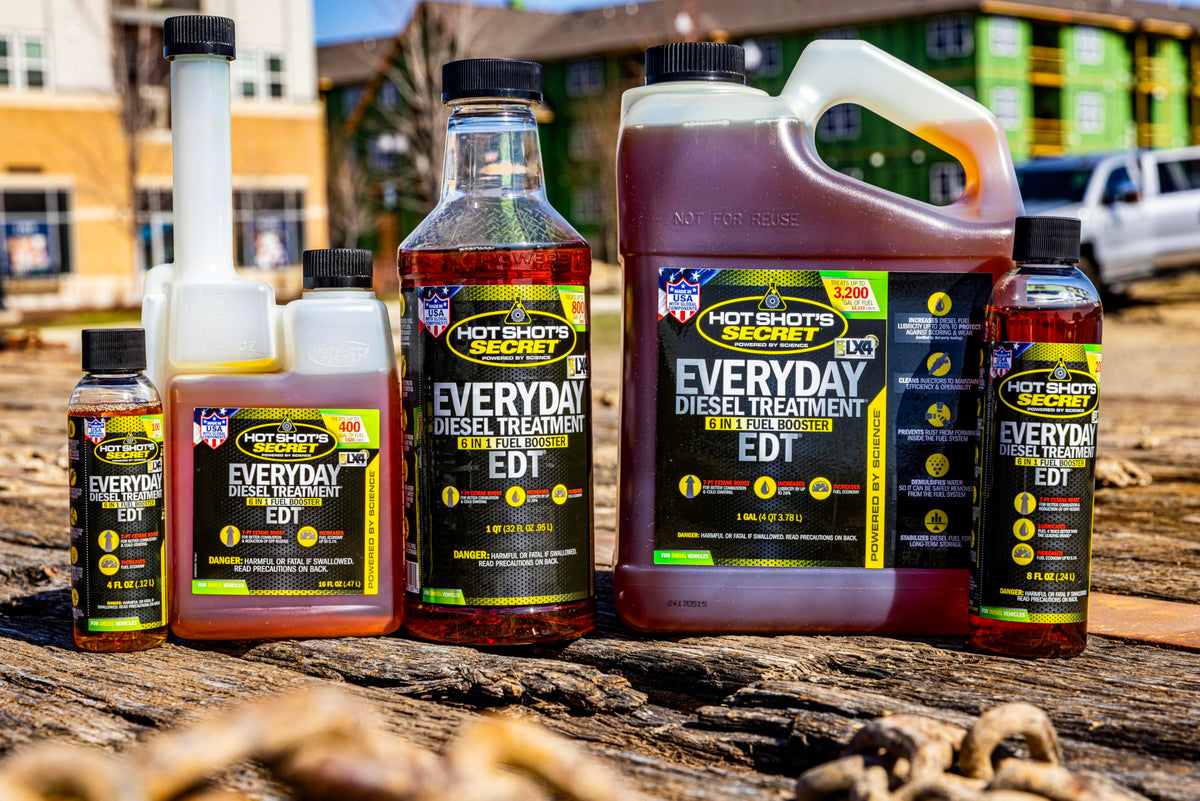 Hot Shot's Secret EDT in pickup truck fueling scene showing engine protection benefit