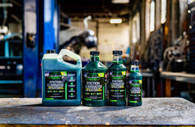 Hot Shot's Secret bottle next to engine bay showing use for reducing wear and stiction