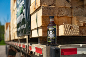 Hot Shot's Secret pouring LX4 into a gas can to show easy use and improved fuel protection