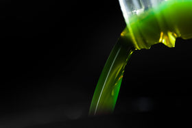 Hot Shot's Secret being poured into oil funnel demonstrating simple addition at oil change