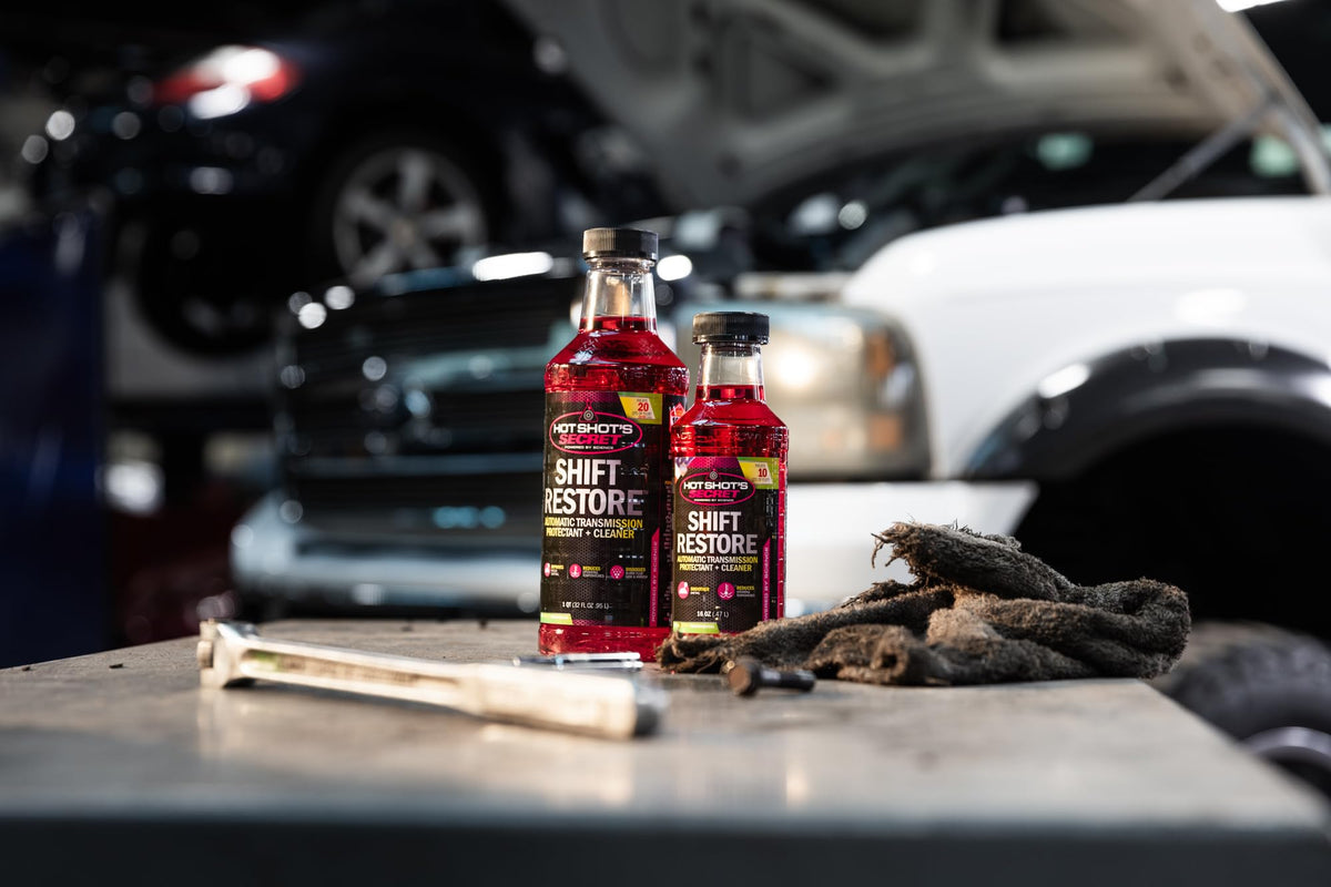 Hot Shot's Secret bottle on garage workbench demonstrating easy application