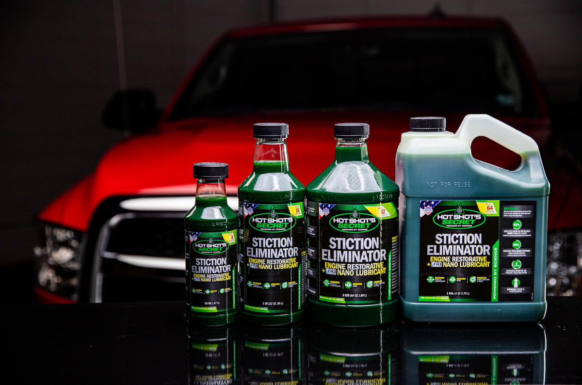 Hot Shot's Secret gallon beside oil filter for scale showing convenient shop-sized supply