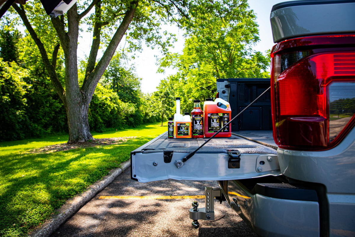 Hot Shot's Secret LX4 being poured into a fuel funnel, showing easy application and protection