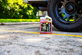 Hot Shot's Secret LX4 gallon next to a common reference object to show scale and volume