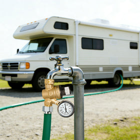 Hourleey regulator on campsite hookup illustrating safer water pressure management