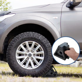 HOXWELL chock placed under RV tire demonstrating stability during parking benefit