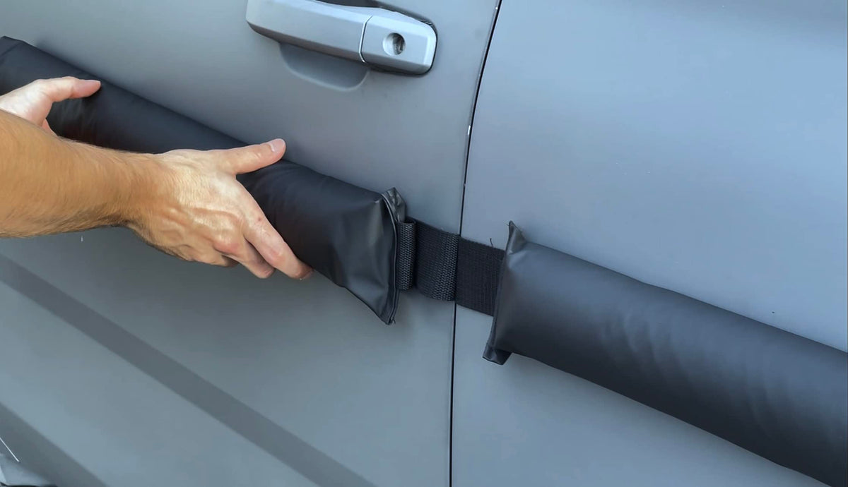 HRX Glass protector beside a hand for scale showing compact, portable size