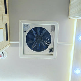 hurrventer in use exhausting hot air from a camper demonstrating cooling benefit