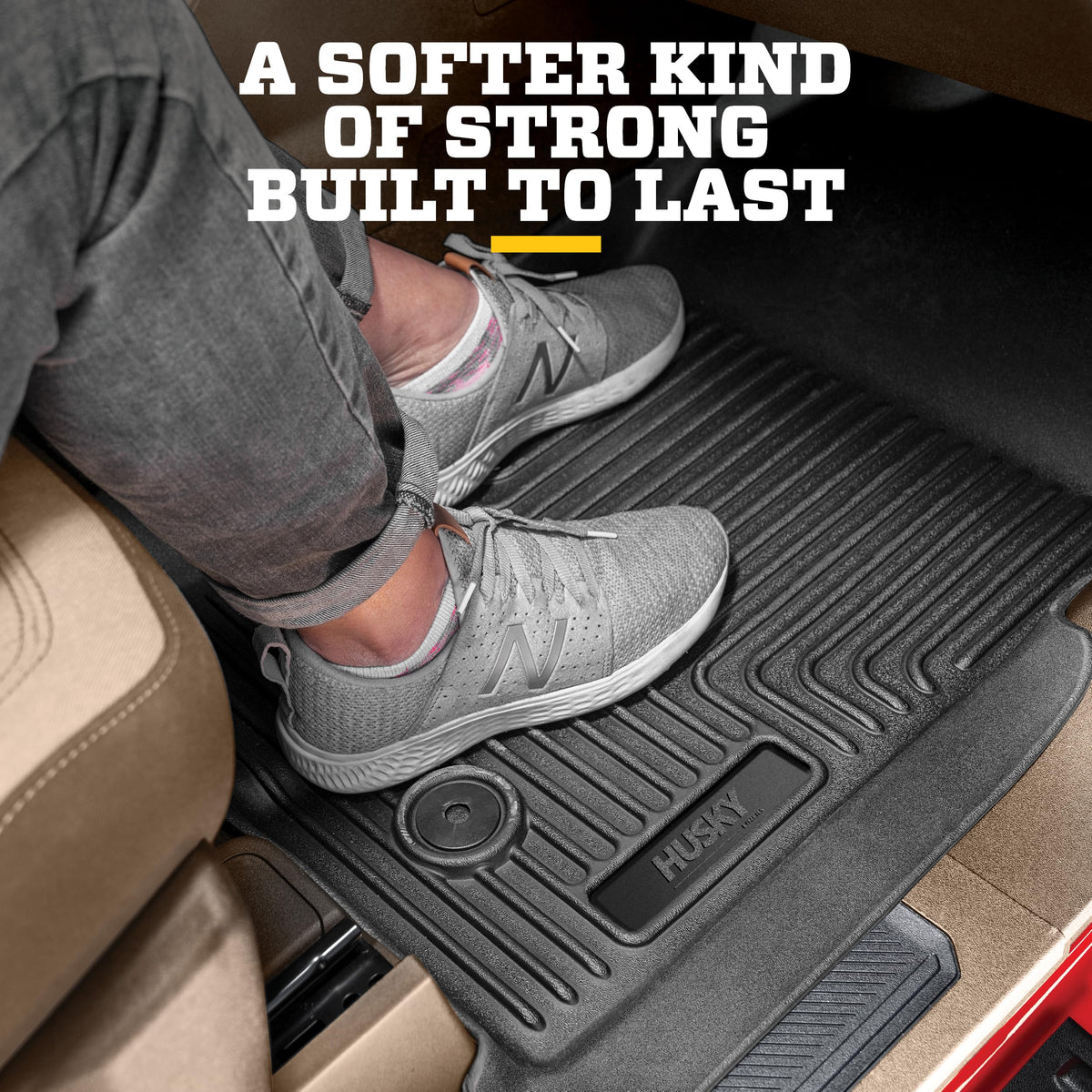 Husky Liners installed passenger-side liner demonstrating edge coverage and protection benefit
