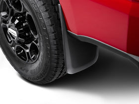 Husky Liners installed on Ford F-250 rear wheel showing real-world debris protection