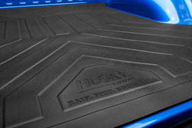 Husky Liners lifestyle shot of gear loading demonstrating cushioned loading benefit