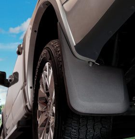 Husky Liners mud guard next to tire showing scale and full tread coverage benefit