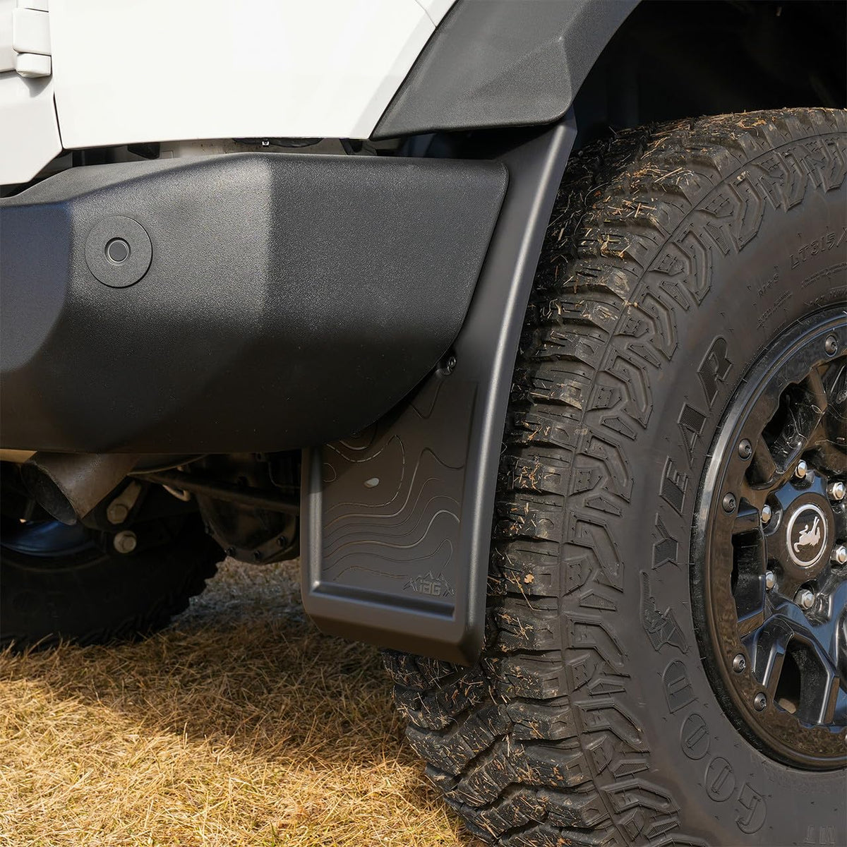 IAG Trail Shield next to tire for scale illustrating clearance and fitment
