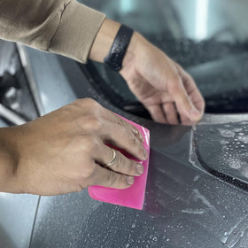 IANFAN tools in use on car door smoothing vinyl for bubble-free finish