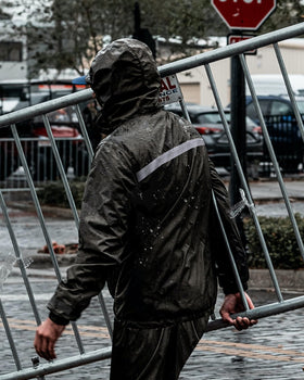 iCreek rain suit worn by worker in field showing durable protection