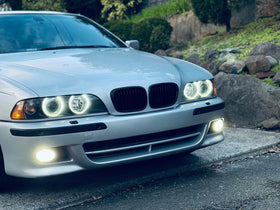 iJDMTOY lifestyle front view of BMW with upgraded halo rings enhancing style