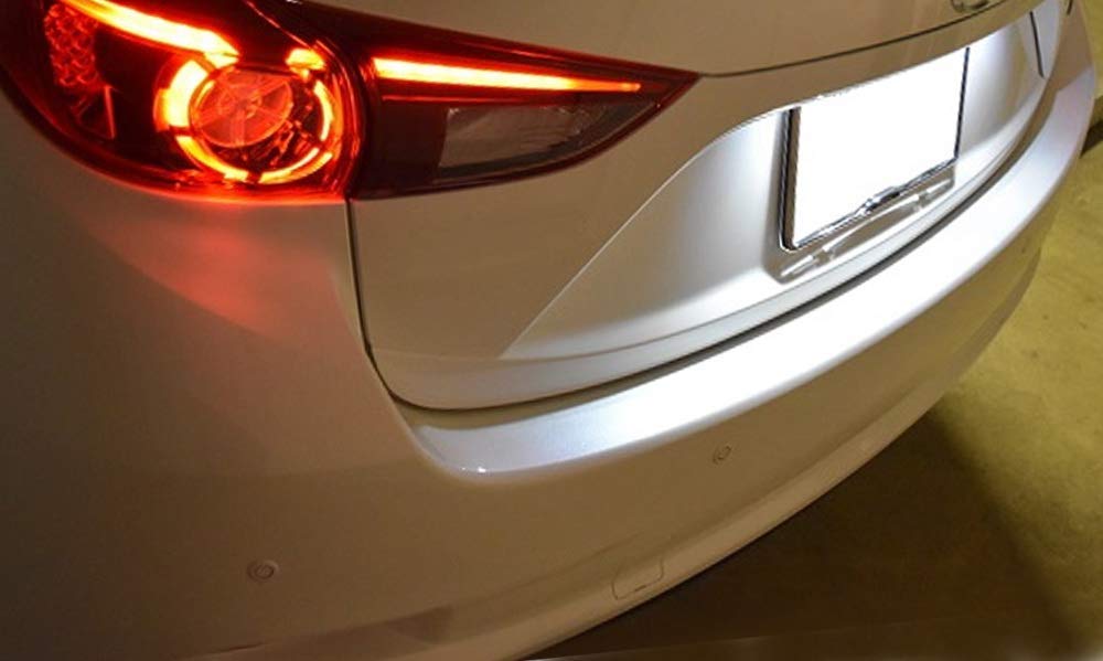 iJDMTOY rear-of-car lifestyle shot at night showing cohesive modern lighting benefit