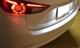 iJDMTOY rear-of-car lifestyle shot at night showing cohesive modern lighting benefit