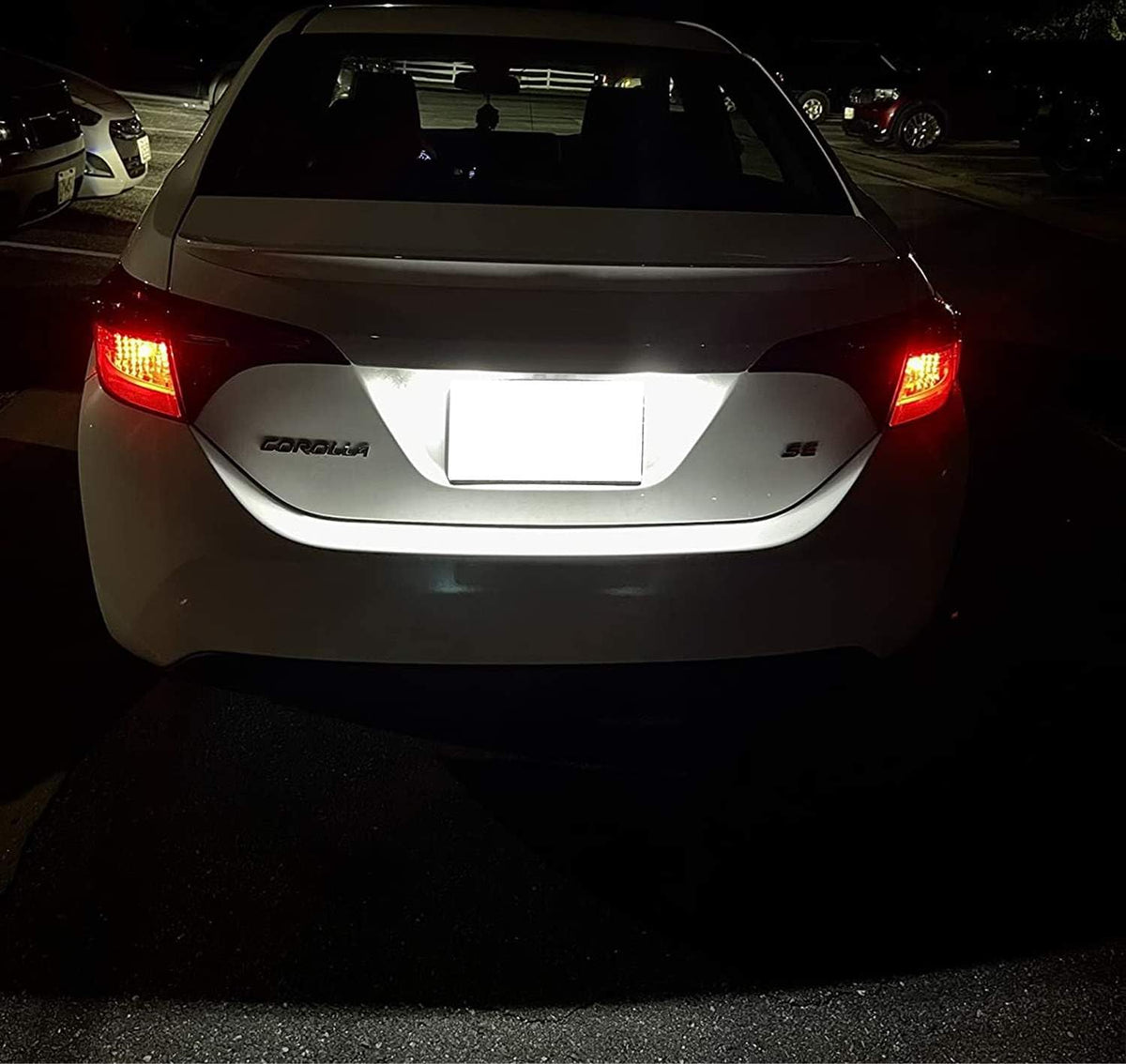 iJDMTOY lit license plate at night demonstrating improved plate readability benefit