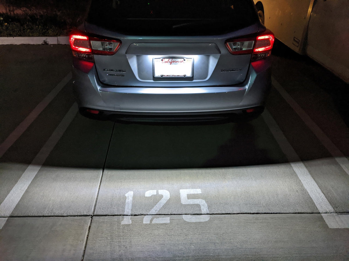 iJDMTOY night shot of license plate showing brighter xenon-white illumination