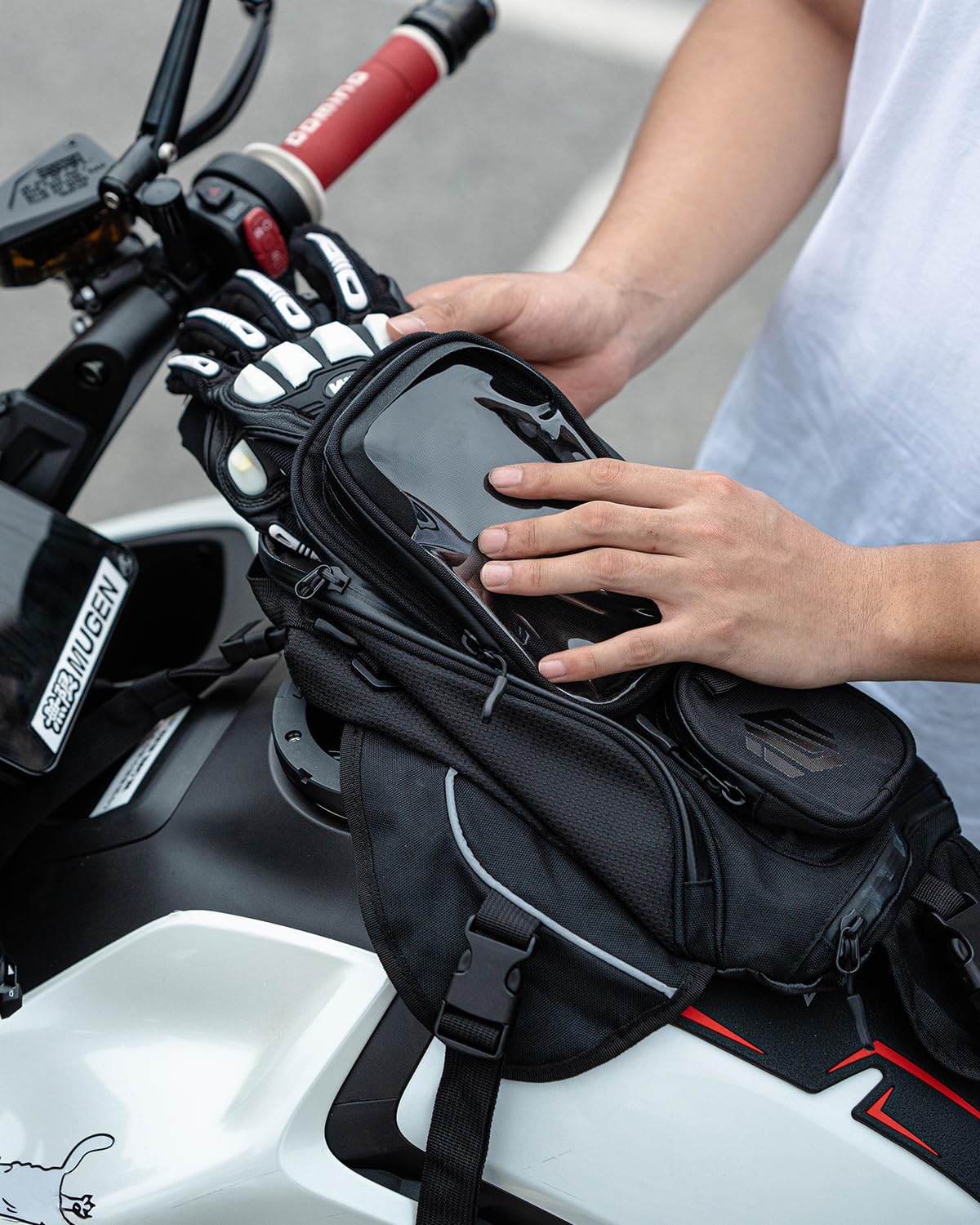 ILM bag beside gloves and smartphone showing real-world size comparison