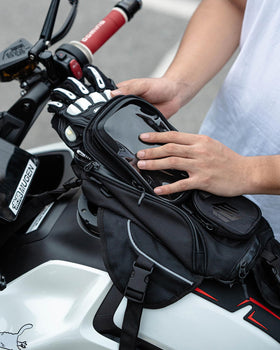 ILM bag beside gloves and smartphone showing real-world size comparison