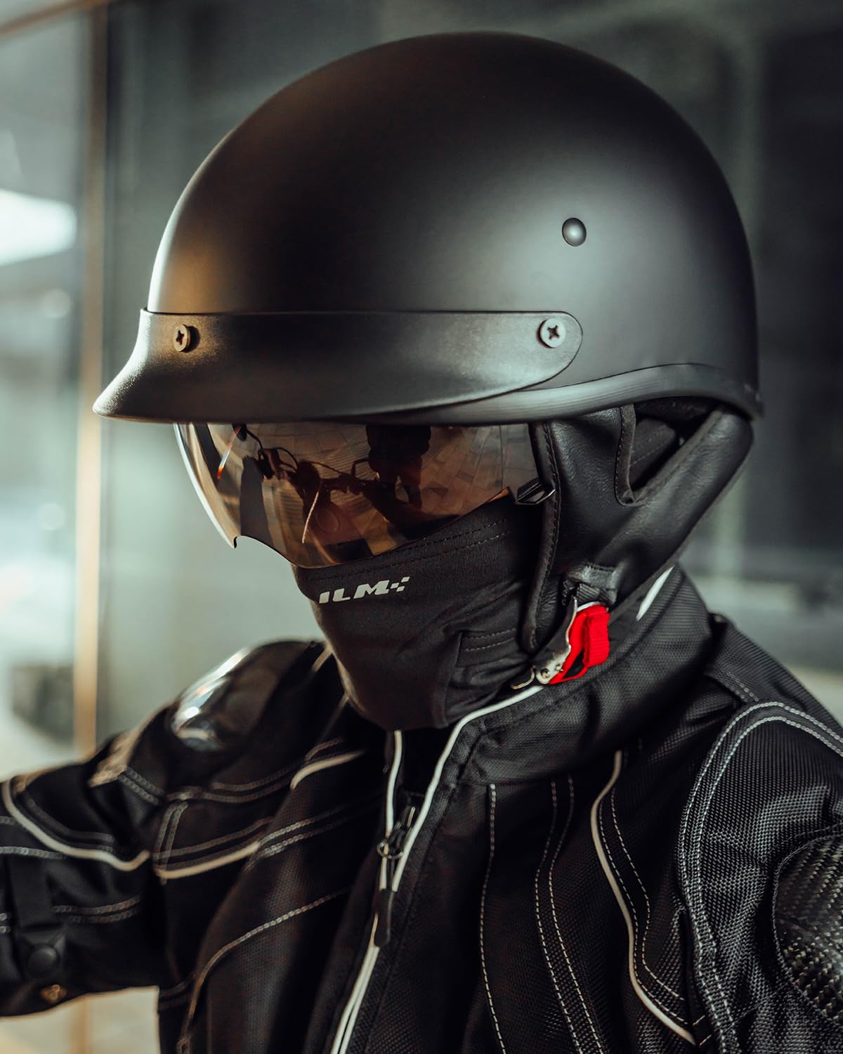 ILM helmet worn by rider in urban setting illustrating everyday commuter use