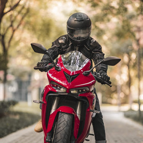 ILM lifestyle rider on bike wearing helmet showing real-world protection