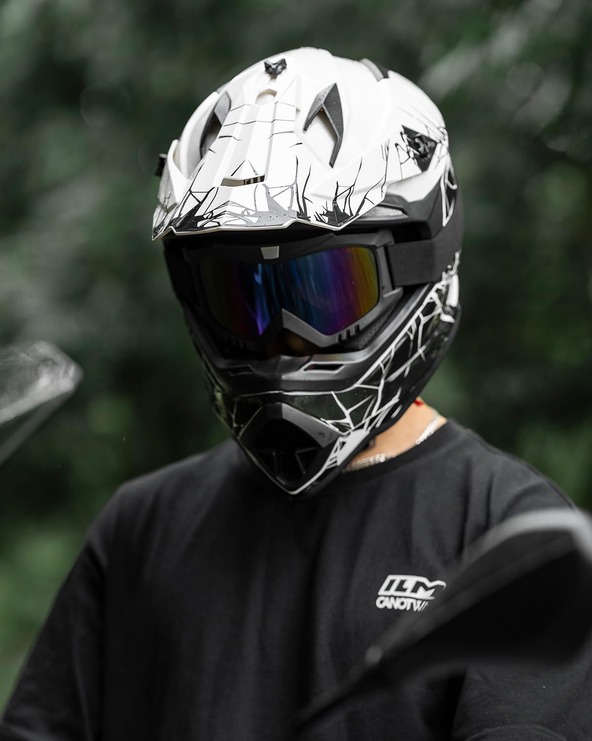 Rider wearing ILM WS901 on dirt trail showing full kit use and visibility benefit