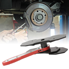 IMAANIIE tool next to a wrench for size comparison and workshop scale reference