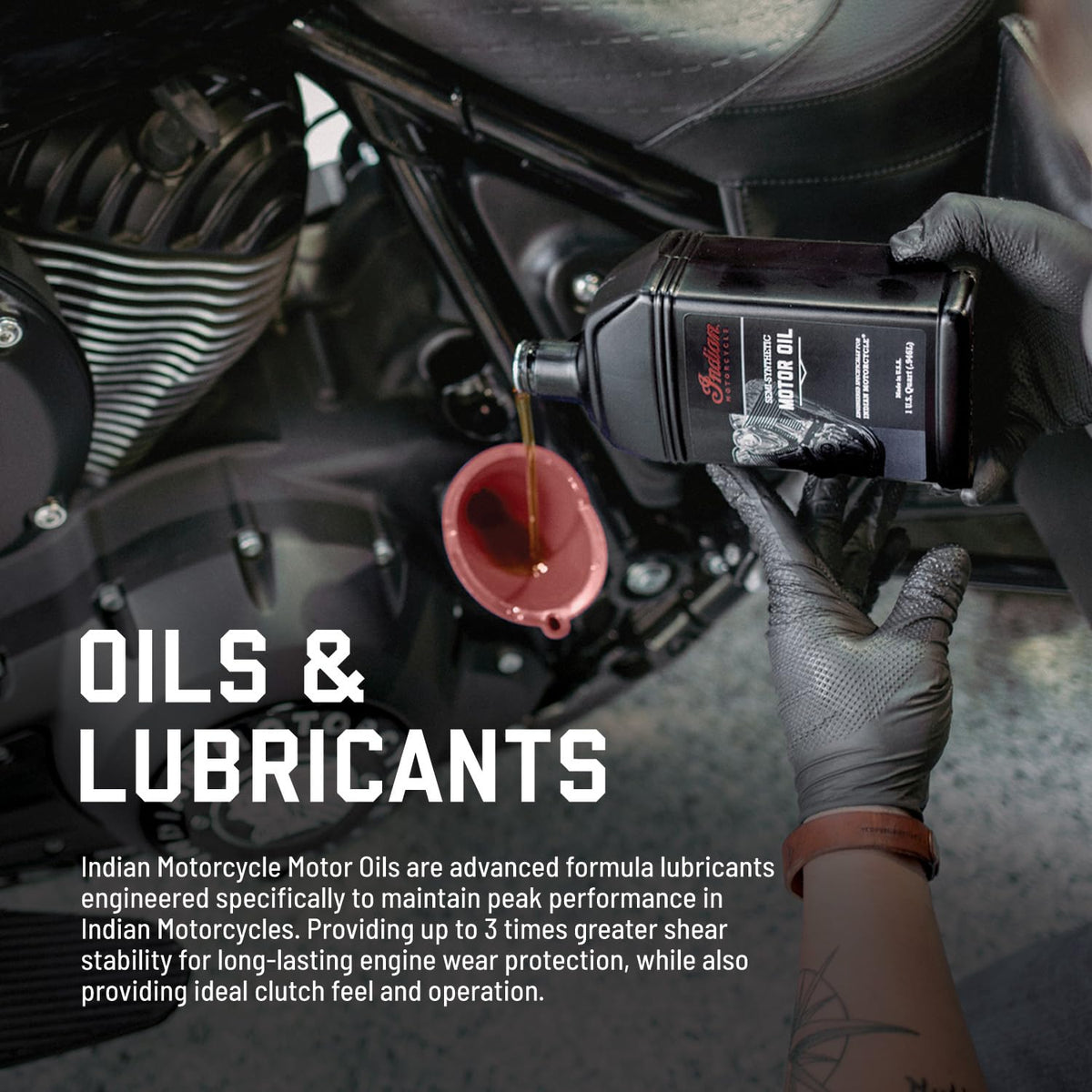 Indian Motorcycle bottle pouring oil into crankcase for cleaner service
