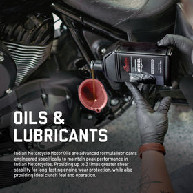Indian Motorcycle bottle pouring oil into crankcase for cleaner service