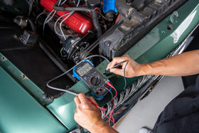 Innova 3340 test leads and holders arranged for hands-free automotive testing
