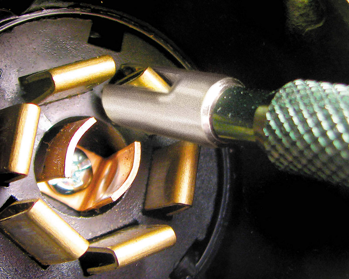 Innovative Products cleaning a trailer connector demonstrating improved contact