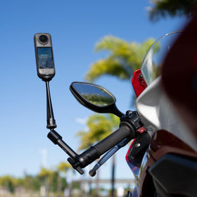 Side profile of Insta360 Magic Arm on a sport bike showing low-profile positioning