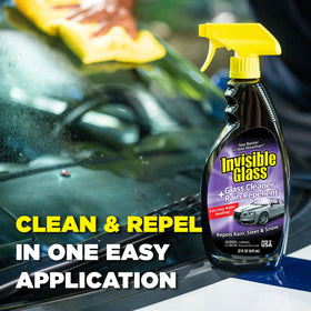 Invisible Glass being sprayed on a car windshield to remove road film and grime