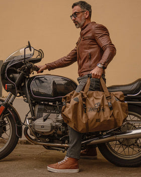 IRON JIA'S padded shoulder strap in carry mode for comfortable transport