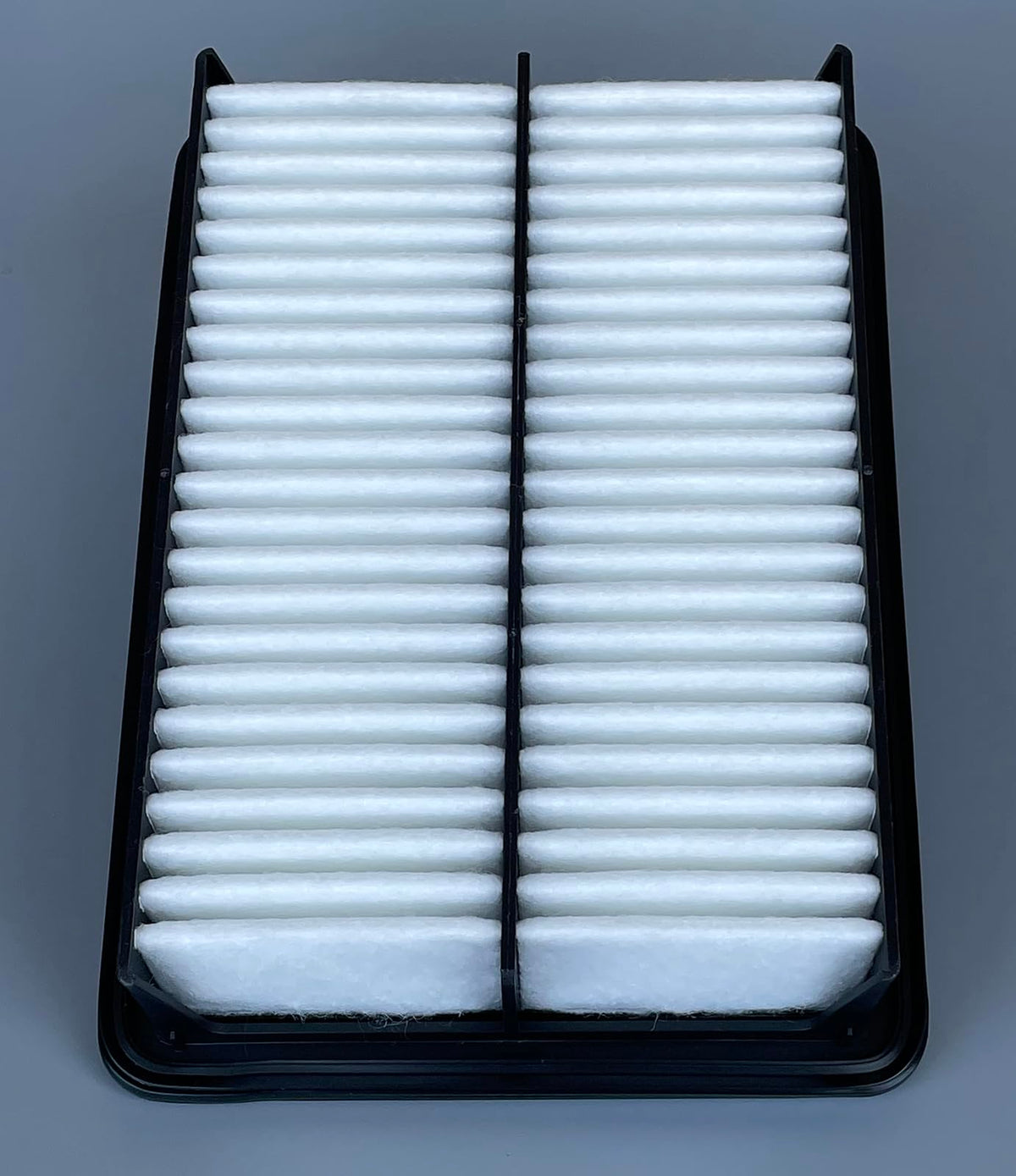 ITESIER cabin filter being inserted under dashboard, illustrating quick maintenance access