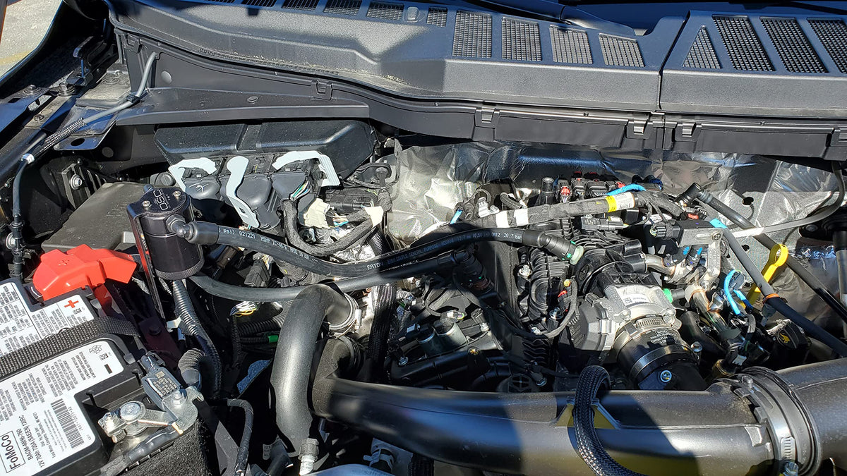 J&L Oil Separator installed in F-150 engine bay demonstrating OEM-style fitment