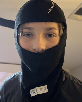 J-RACING balaclava in motorsport setting showing driver comfort and performance