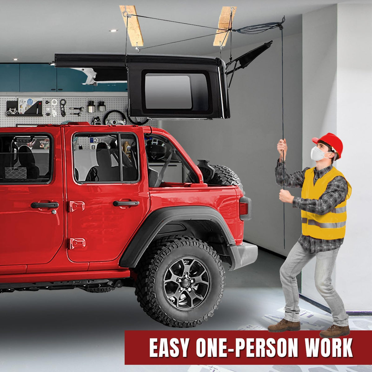 Jack Boss hoist in use as one person raises a Jeep Wrangler hardtop safely and smoothly