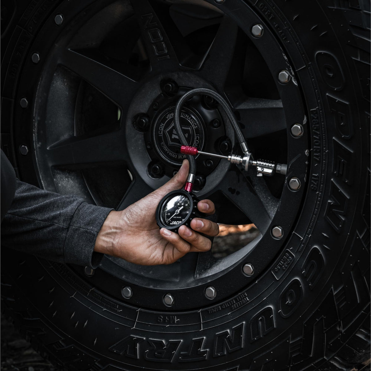 JACO Lightning RX4 in use deflating tire on trail illustrating fast, controlled air-down