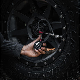 JACO Lightning RX4 in use deflating tire on trail illustrating fast, controlled air-down