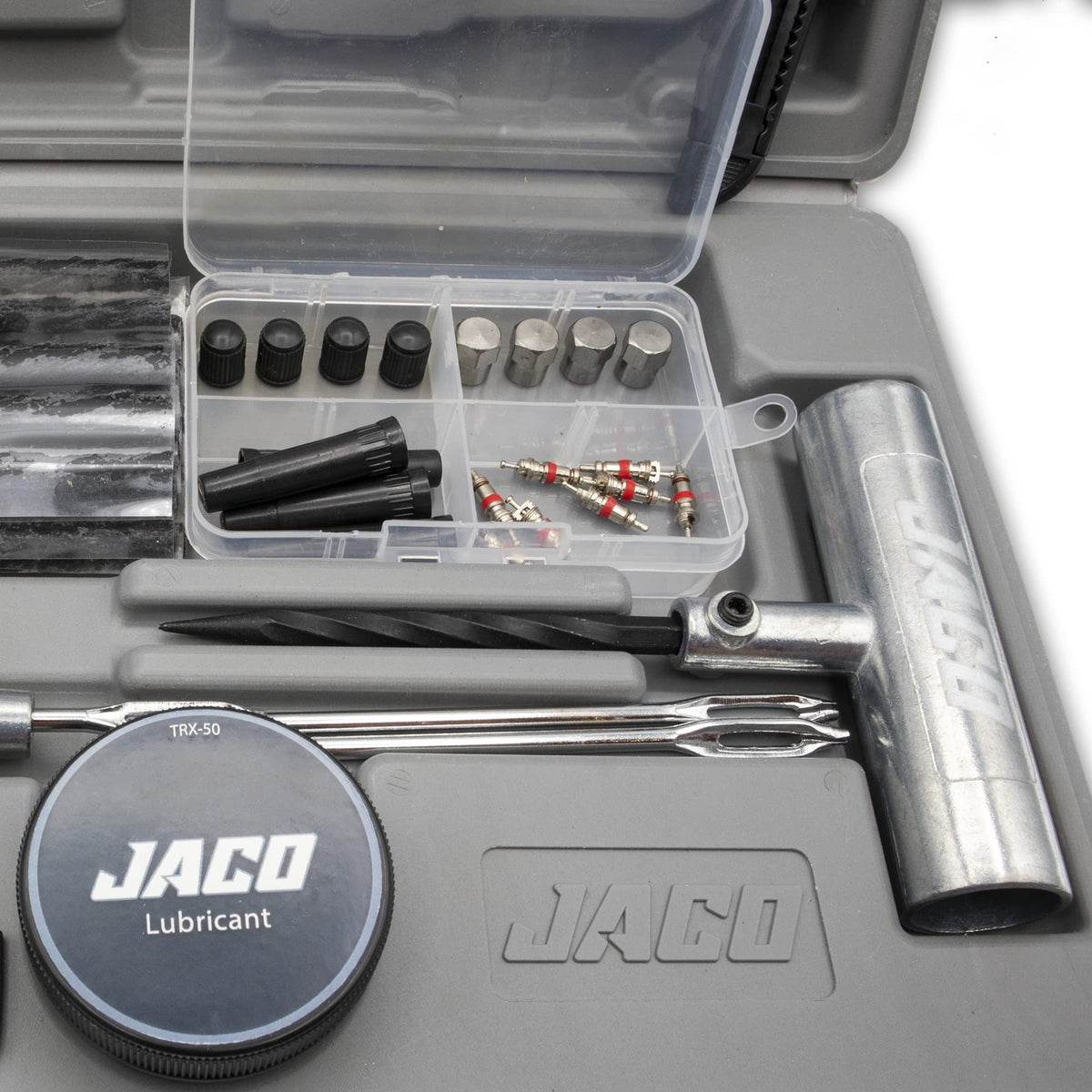 JACO TRX-50 next to a hand for scale showing compact travel-ready size
