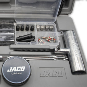 JACO TRX-50 next to a hand for scale showing compact travel-ready size