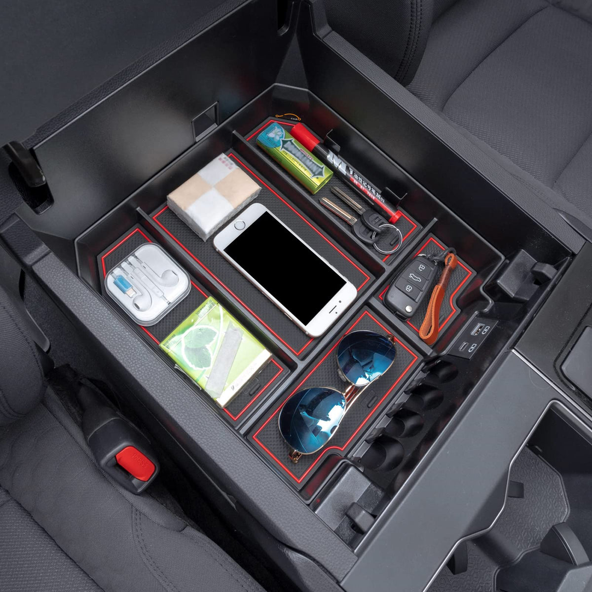 JDMCAR organizer beside common items for scale showing compact, space-saving advantage